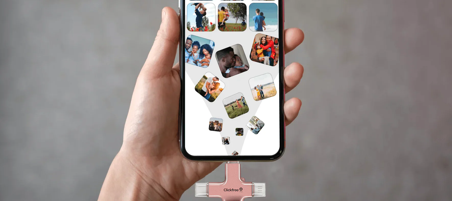 Hand holding a phone with family photos and a connected ClickFree Pro