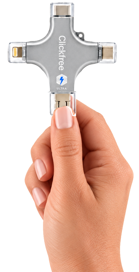 Right hand pinching a silver ClickFree Ultra