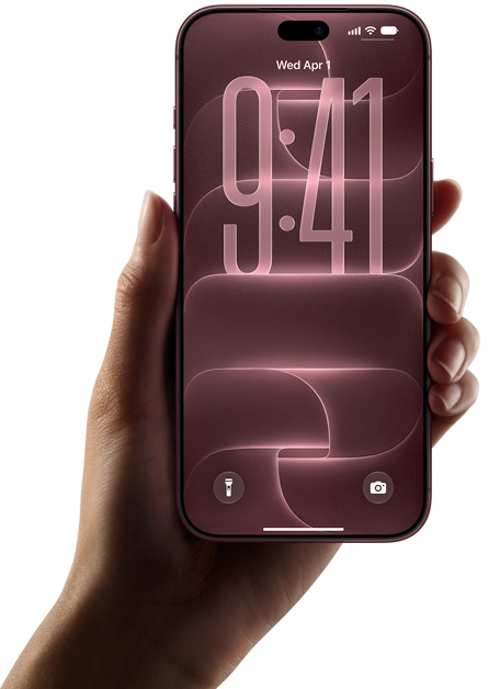Hand holding a burgundy iPhone